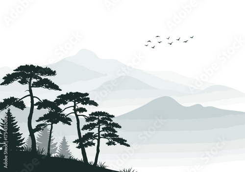 Serene Mountain Landscape with Silhouette Trees and Birds in Flight.