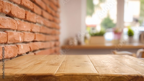 A wooden table rests against a rustic brick wall in a cozy indoor setting,