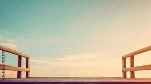 An empty wooden boardwalk stretches into a serene outdoor scene with a sky blue backdrop and soft clouds,