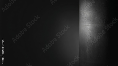 A minimalist scene featuring a thick concrete pillar stands prominently against a plain background,