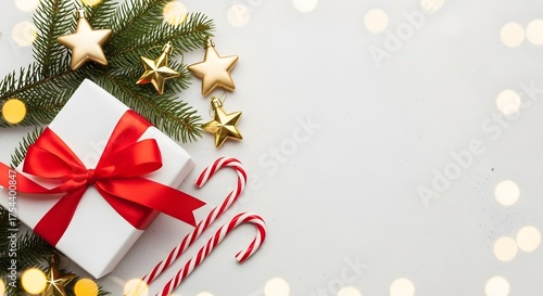 Christmas gift box with red ribbon and festive decorations