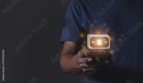 Young man with smartphone hand holding to visualize money growth The phone screen displays graphs and charts showing increasing investment and savings trends, along with an increased account balance