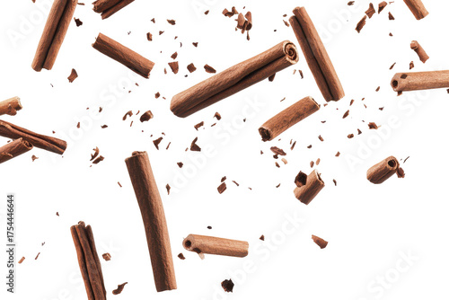 Cinnamon sticks falling and floating isolated on transparent background. Falling cinnamon sticks isolated on white background.