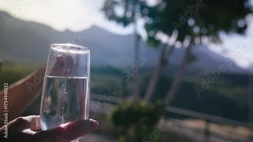 Female Holding Champagne Flute and Talking in Scenic Nature Landscape During Evening Time