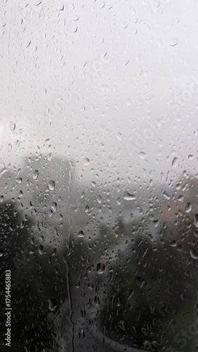 Rain Spattered Window Overlooking Blurred Cityscape