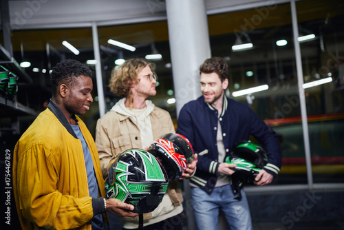 Wallpaper Mural Friends enjoying a fun day choosing helmets for their exciting carting adventure Torontodigital.ca