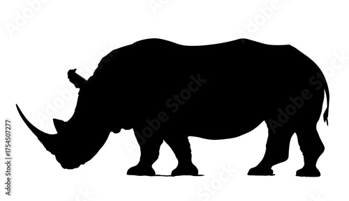 A silhouette of a large, stocky animal with a prominent horn, standing on four legs