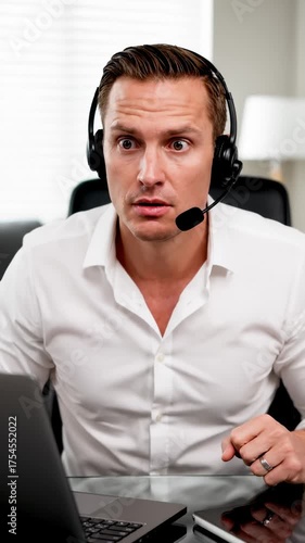 Angry Man Screaming Wearing Headset and Looking at Laptop Screen