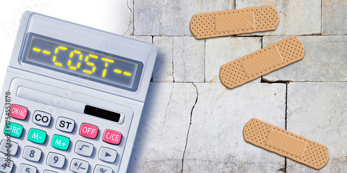 Old stone wall cracked and damaged due to structural failure - repair and renovation costs concept with calculator and bandaid patch