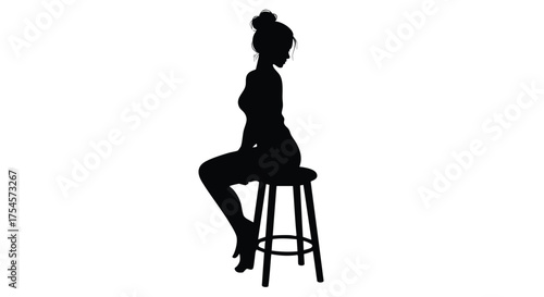 Silhouette of a woman sitting on a stool