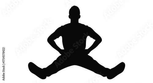 Silhouette of a person performing a wide-legged stretch exercise, demonstrating flexibility and fitness