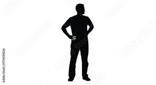 Silhouette of a person standing with hands on hips, looking away