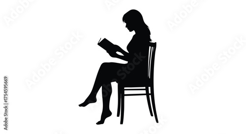 Silhouette of a woman sitting on a chair reading a book