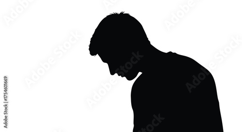 A stark black silhouette of a young man with his head bowed in sadness, illustrating concepts of depression, loneliness, and mental health challenges