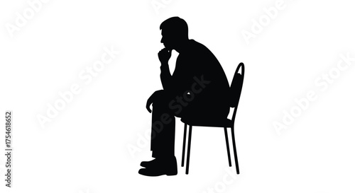 Silhouette of a man sitting on a chair, deep in thought, with his hand on his chin