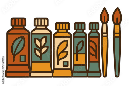 Assortment of earthy toned paint tubes decorated with natural leaf patterns next to artist brushes