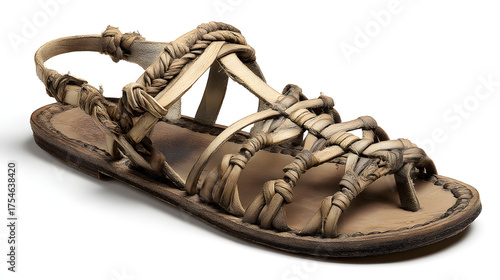 Ancient sandal isolated on white background is displayed in a studio shot