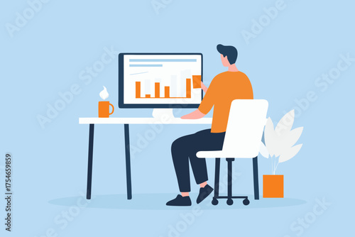 Man sitting at a desk working on a computer displaying a bar chart and graphs with a coffee mug and plant