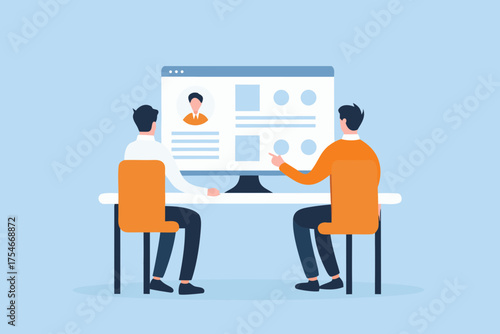 Two people reviewing a computer screen displaying a profile and data on a desk with blue background
