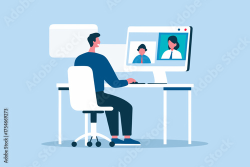 Man participating in a video conference call on his computer while working from home