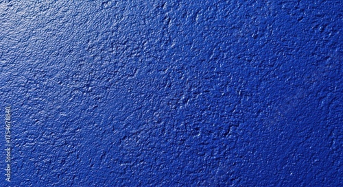 Textured blue surface with light variation