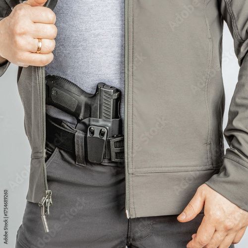 Photography Man with pistol holster under jacket