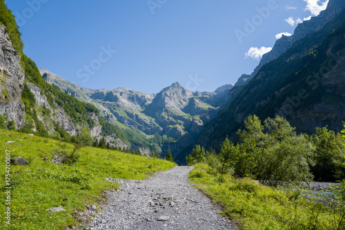 This landscape photo was taken in Europe, France, Auvergne-Rhone-Alpes, Haute-Savoie, Sixt-Fer-a-Cheval, in summer. It shows the hiking trail in the mountains of the Cirque du Fer-a-Cheval