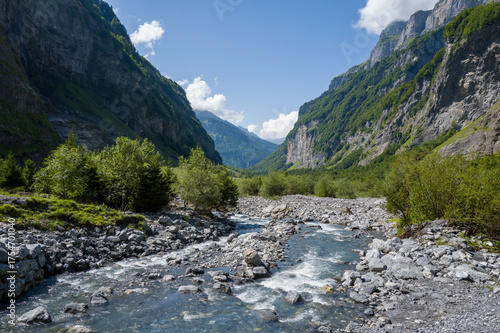 This landscape photo was taken in Europe, France, Auvergne-Rhone-Alpes, Haute-Savoie, Sixt-Fer-a-Cheval, in summer. It shows the hiking trail in the mountains of the Cirque du Fer-a-Cheval