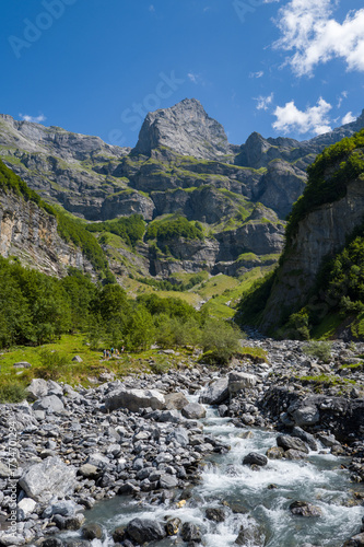 This landscape photo was taken in Europe, France, Auvergne-Rhone-Alpes, Haute-Savoie, Sixt-Fer-a-Cheval, in summer. It shows the hiking trail in the mountains of the Cirque du Fer-a-Cheval