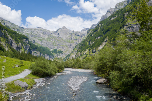 This landscape photo was taken in Europe, France, Auvergne-Rhone-Alpes, Haute-Savoie, Sixt-Fer-a-Cheval, in summer. It shows the hiking trail in the mountains of the Cirque du Fer-a-Cheval