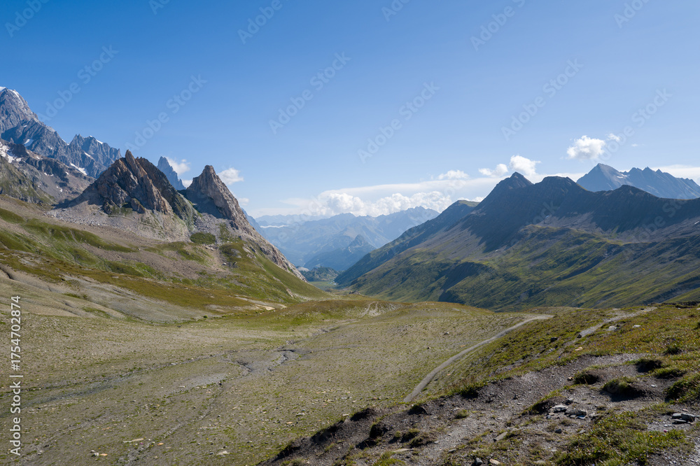Fototapeta premium This landscape photo was taken in Europe, France, Auvergne Rhone Alpes, Haute Savoie, in summer. We can see the Col de la Seigne, under the Sun.