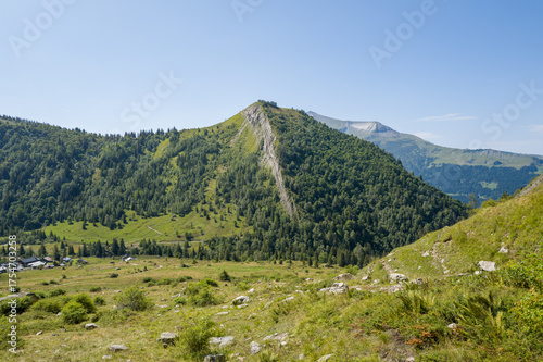 This landscape photo was taken in Europe, France, Auvergne Rhone Alpes, Haute Savoie, in summer. We can see Mont Truc, under the Sun.