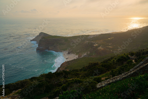 The cliffs and waves of the Cape of Good Hope in South Africa at dusk