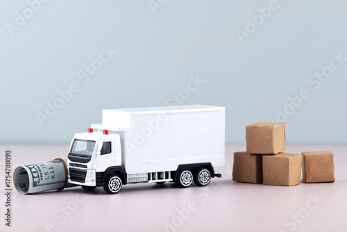 White toy truck with boxes on a light background, space for text.