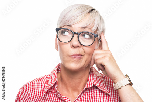 Crafty adult woman thinking. Closeup portrait of smart person looking for inspiration, copy space for text, isolated on white background. Thoughtful middle aged woman looking up.