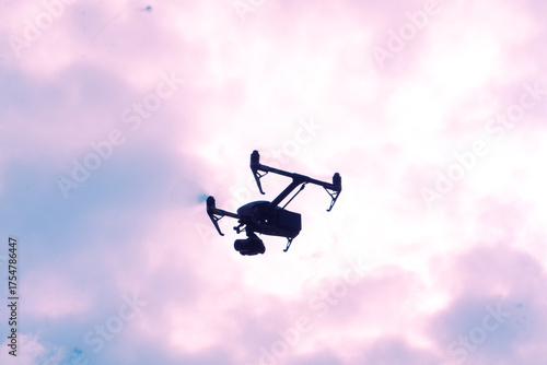 Professional drone shilquotte flying from sky