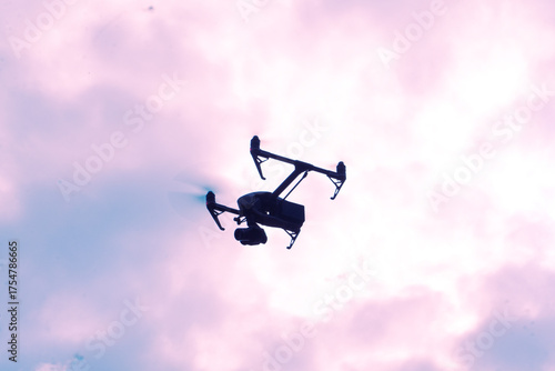Professional drone shilquotte flying from sky