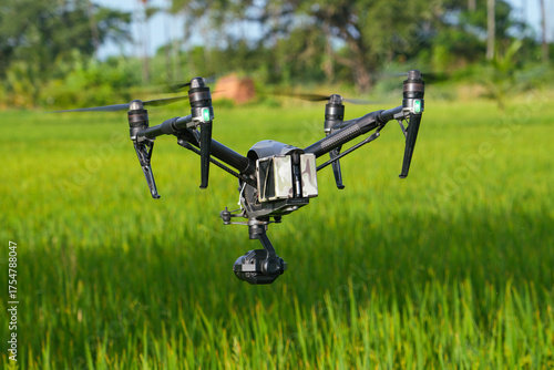 Professional cinema camera drone filming natural green agri feild