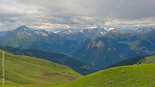 granite mountain peaks with glaciers under a dark stormy sky n La Vanoise national park, Savoie, France 