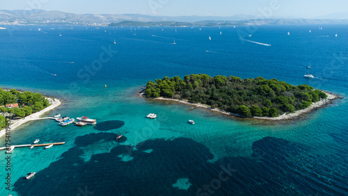 Wallpaper Mural Aerial view of small green islands surrounded by deep blue sea with yachts and sailboats anchored near the rocky shore on a sunny day Torontodigital.ca