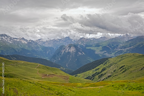 green mountain landscape under a cloudy sky in La Vanoise nature reserve, Savoie, France
