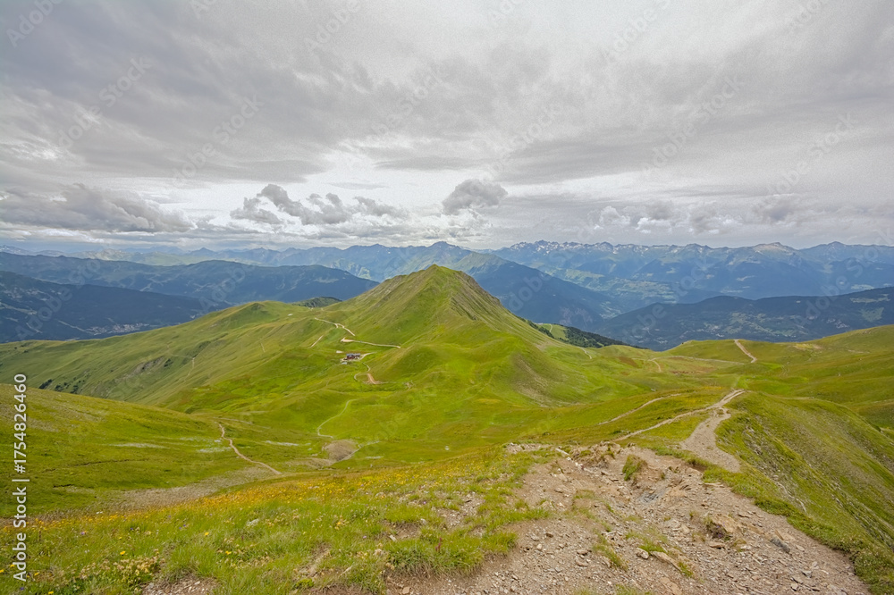 Fototapeta premium green mountain landscape under a cloudy sky in La Vanoise nature reserve, Savoie, France 