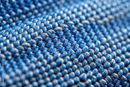 Wallpaper Mural Textile Texture in Blue: A macro perspective captures the intricate details of woven fabric in hues of blue, showcasing a sense of craftmanship. Focus on the subtle textures and complex patterns. Torontodigital.ca