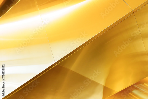 Abstract golden metal surface with modern geometric lines, luxury background design for business, technology, or premium branding, symbolizing elegance, wealth, and contemporary style.