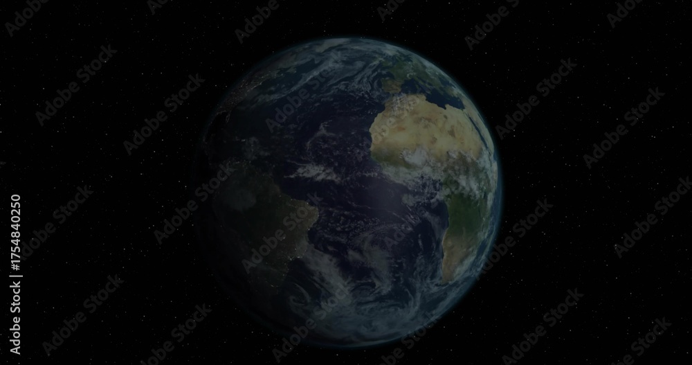 Fototapeta premium Floating blue planet Earth rotating slowly in vacuum of outer space, with distant stars