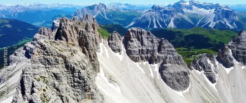 Wallpaper Mural Aerial views of majestic Dolomites Mountain peaks with clear blue sky day time Torontodigital.ca