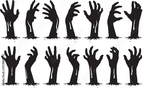Collection of silhouetted zombie hands reaching up from the ground