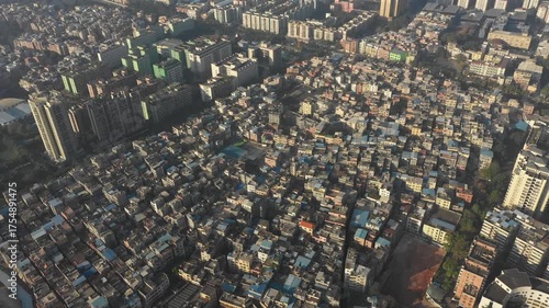 Tilting drone shot of low-rise suburban houses in Guangzhou city, China
