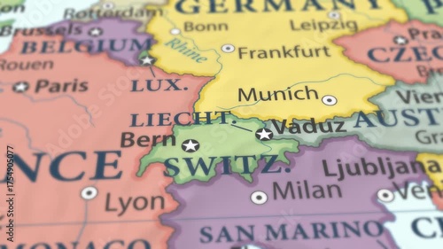 4K macro video of Liechtenstein on a world map with shallow depth of field. Focus on word Liechtenstein and surrounding areas including Switzerland, Austria, and Central Europe. Travel geography foota