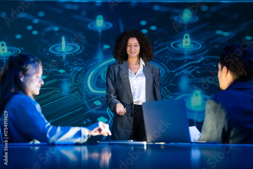 Cybersecurity expert leading a strategy meeting, presenting on data protection, network security, and privacy to her team.